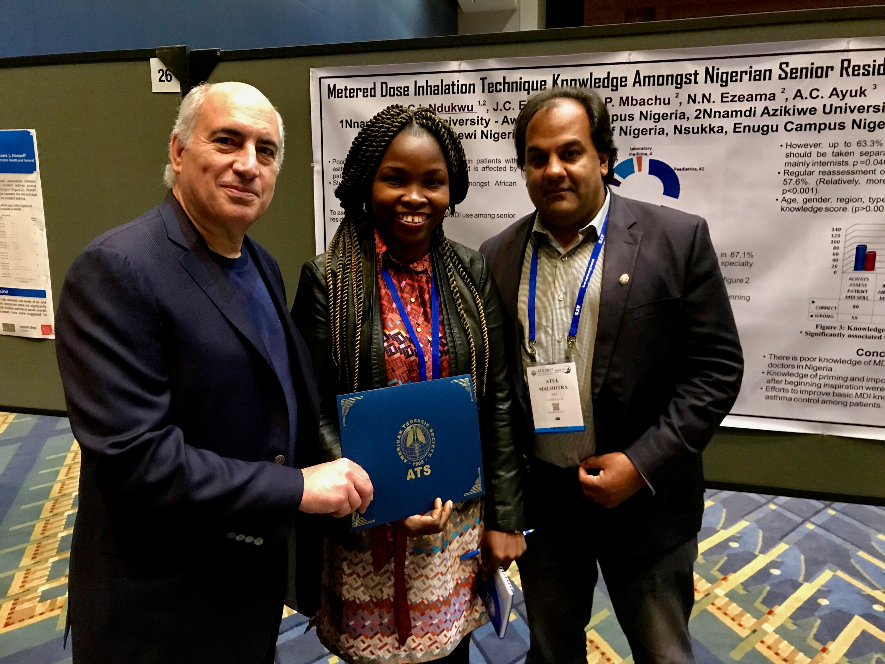 Cosmo distributing the CDC Scholarship at the ATS Conference